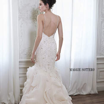 A swirling cascade of Dione organza adorns this dramatic fit and flare wedding dress, perfect for the modern bride. Complete with sparkling Swarovski crystal bodice, deep sweetheart neckline and dainty beaded spaghetti straps. Finished with zipper back closure.

<a href="http://www.maggiesottero.com/dress.aspx?style=5MR163" target="_blank">Maggie Sottero Spring 2015</a>