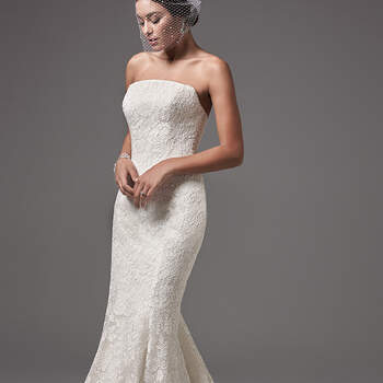 This modern and sophisticated strapless fit-and-flare features floral lace motifs and a chic straight neckline. Finished with covered buttons over zipper and inner corset closure. 
<a href="https://www.maggiesottero.com/sottero-and-midgley/linley/10236?utm_source=mywedding.com&amp;utm_campaign=spring17&amp;utm_medium=gallery" target="_blank">Sottero and Midlgey</a>