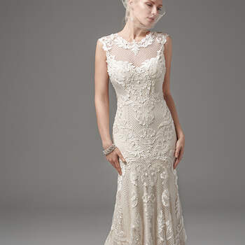 This unique and glamorous fit-and-flare features laser-cut lace over textured netting and Viva jersey lining with an illusion jewel over scoop neckline, illusion cap-sleeves, and illusion open back, all trimmed with lace appliqués. Finished with covered buttons and zipper closure. 
<a href="https://www.maggiesottero.com/sottero-and-midgley/suzanne/10252?utm_source=mywedding.com&amp;utm_campaign=spring17&amp;utm_medium=gallery" target="_blank">Sottero and Midgley</a>