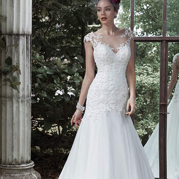 An illusion bateau neckline and stunning keyhole back, accented with hand-placed lace appliqués, create drama and romance in this A-line wedding dress, finished with flowing tulle skirt and covered buttons over zipper and inner elastic closure.

<a href="http://www.maggiesottero.com/dress.aspx?style=5MS673" target="_blank">Maggie Sottero</a>