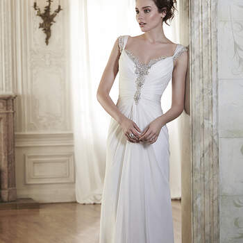 This sophisticated Elysium chiffon sheath dress is sweetened with glittering Swarovski crystals trailing the neckline and scalloped back. Complete with Swarovski crystal edged cap-sleeves. Finished with crystal button over zipper closure.

<a href="http://www.maggiesottero.com/dress.aspx?style=5MR040" target="_blank">Maggie Sottero Spring 2015</a>