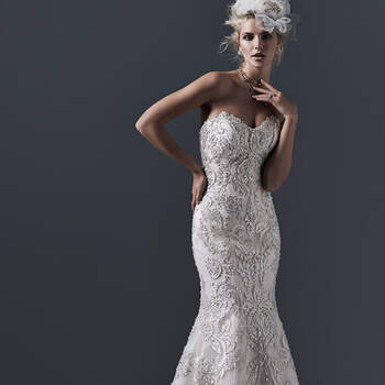 Dramatic lace appliqués on tulle, embellished with dazzling Swarovski crystals and pearls, drift down the length of this fit and flare wedding dress. Finished with scoop neckline and crystal buttons over zipper and inner corset closure.


<a href="http://www.sotteroandmidgley.com/dress.aspx?style=5SW617" target="_blank">Sottero &amp; Midgley</a>