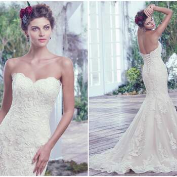 Lace artfully placed atop tulle adds sophistication to this feminine fit and flare wedding dress. Finished with a soft sweetheart neckline, scalloped hemline, and corset closure. 

<a href="https://www.maggiesottero.com/maggie-sottero/valerie/9694" target="_blank">Maggie Sottero</a>