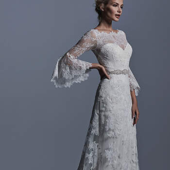 Bohemian romance is found in this lace slim A-line wedding dress, with bell sleeves, and illusion front and back neckline and backline, and Swarovski crystal belt. Finished pearl buttons over zipper and inner elastic closure.


<a href="http://www.sotteroandmidgley.com/dress.aspx?style=5SR612" target="_blank">Sottero &amp; Midgley</a>
