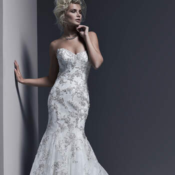 A timeless and sophisticated style, this Chantilly lace fit and flare wedding dress is sweetened with lavish Swarovski crystal beaded lace motifs adorning the bodice and skirt, and edging the hemline. Finished with corset or covered buttons and zipper over inner corset back closure.
<img height='0' width='0' alt='' src='http://ads.zankyou.com/mn8v' />