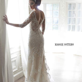 A dramatic illusion lace back and illusion sleeves adorn this hand-embellished sheath gown, glimmering with metallic lace appliqués and embroidered with Swarovski crystals drifting from shoulder to floor-skimming hem. A delicate scalloped hemline completes the look. Finished with pearl button over zipper back closure.


<a href="http://www.maggiesottero.com/dress.aspx?style=5MW113" target="_blank">Maggie Sottero Spring 2015</a>