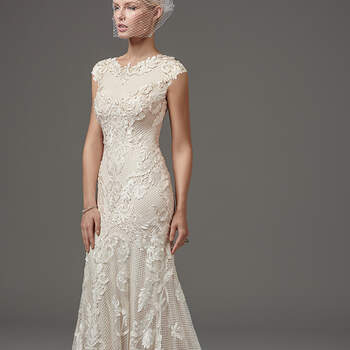 This unique and glamorous fit-and-flare features laser-cut lace over textured netting and Viva jersey lining with a jewel neckline and modest cap-sleeves trimmed with lace appliqués. Finished with zipper closure. 
<a href="https://www.maggiesottero.com/sottero-and-midgley/suzanne-rose/10253?utm_source=mywedding.com&amp;utm_campaign=spring17&amp;utm_medium=gallery" target="_blank">Sottero and Midgley</a>
