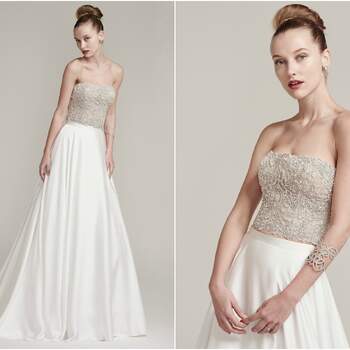 Bead encrusted strapless bodice sparkles with Swarovski crystals. Finished with crystal buttons over zipper closure. Inessa satin A-line skirt with delicate waistband and zipper closure.

<a href="https://www.maggiesottero.com/sottero-and-midgley/rosella-aviana-marie/9962" target="_blank">Sottero &amp; Midgley</a>