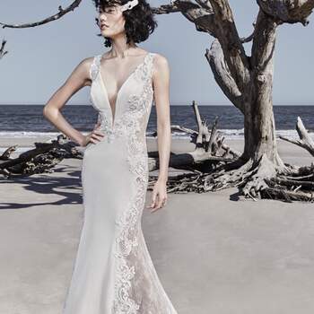 <a href="https://www.maggiesottero.com/sottero-and-midgley/bradford/11521">Maggie Sottero</a>

Sheer lace and lace motifs comprise the side insets, statement back, and statement train in an Avia stretch velvet sheath wedding dress, creating a uniquely sexy look.