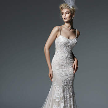 Bold patterned lace adorns a portrait illusion front and back neckline in this stunning mermaid wedding dress, complete with flared tulle skirt. Finished with covered buttons over zipper closure.
<img height='0' width='0' alt='' src='http://ads.zankyou.com/mn8v' />