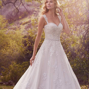 This breathtaking A-line features lace appliqués, shimmering embroidery, and a scalloped hem accented with exquisite pearls and beading. Finished with covered 
buttons over zipper and inner corset closure. Detachable cap-sleeves with lace appliqués sold separately.  
<a href="https://www.maggiesottero.com/maggie-sottero/reba/10134?utm_source=mywedding.com&amp;utm_campaign=spring17&amp;utm_medium=gallery" target="_blank">Maggie Sottero</a>