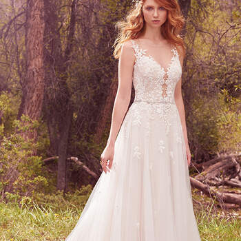A subtly embellished bodice features an illusion plunging neckline, beaded crosshatch embroidery, and delicate lace appliqués that cascade into a tulle skirt. A dazzling beaded belt and illusion open-back trimmed with lace appliqués complete the airy romance of this look. Finished with covered buttons over zipper closure.
<a href="https://www.maggiesottero.com/maggie-sottero/avery/10084?utm_source=mywedding.com&amp;utm_campaign=spring17&amp;utm_medium=gallery" target="_blank">Maggie Sottero</a>