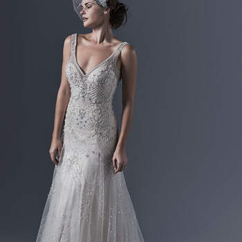Glamour vintage pour cette magnifique robe de mariée coupe en A. Le tout est composé de tulle léger, orné de perles chatoyantes et de scintillants cristaux Swarovski. Ici encore, le décolleté plongent donne toute la dimension à la robe.
<a href="http://www.sotteroandmidgley.com/dress.aspx?style=5ST633" target="_blank">Sottero &amp; Midgley</a>
