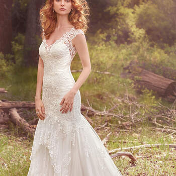 A three-tiered skirt hemmed in scalloped lace appliqués adds romance and whimsy to this classic fit-and-flare. Lace motifs adorn the bodice, illusion V-neckline, illusion straps, and illusion open-back. Finished with covered buttons over zipper closure. 
<a href="https://www.maggiesottero.com/maggie-sottero/zalia/10155?utm_source=mywedding.com&amp;utm_campaign=spring17&amp;utm_medium=gallery" target="_blank">Maggie Sottero</a>