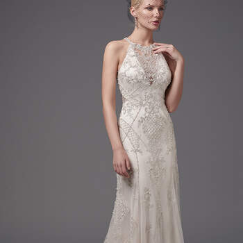 Shimmering beaded lace appliqués and crosshatching add luster and dimension to this glamorous sheath, highlighting the waistline, illusion halter over V-neck, and illusion open back. Embellished lace hem completes the gown's striking lines. Finished with crystal buttons over zipper closure. 
<a href="https://www.maggiesottero.com/sottero-and-midgley/felicia/10220?utm_source=mywedding.com&amp;utm_campaign=spring17&amp;utm_medium=gallery" target="_blank">Sottero and Midgley</a>