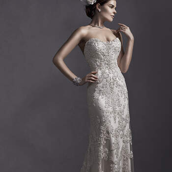 Dramatic lace appliqués on tulle, embellished with dazzling Swarovski crystals, drift down the length of this Ava satin sheath dress, complete with strapless, sweetheart neckline. Finished with crystal button over zipper and inner corset closure.

<a href="http://www.sotteroandmidgley.com/dress.aspx?style=5SR053" target="_blank">Sottero and Midgley Spring 2015</a>