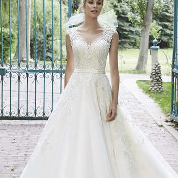 This tulle ballgown is the epitome of bridal bliss. Complete with dazzling Swarovski crystals accenting the bodice and illusion neckline, scalloped lace hemline, and delicate satin belt at the waist. Finished with pearl button over zipper and inner elastic closure.
<a href="http://www.maggiesottero.com/dress.aspx?style=5MS021&amp;page=0&amp;pageSize=36&amp;keywordText=&amp;keywordType=All" target="_blank">Maggie Sottero</a>