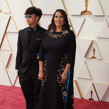 Oscar® nominee Germaine Franco and guest arrive on the red carpet of the 94th Oscars® at the Dolby Theatre at the Ovation Hollywood in Los Angeles, CA, on Sunday, March 27, 2022.