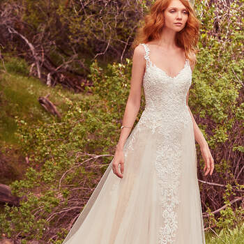 Ethereal and romantic, this sheath features cascades of lace appliqués over layers of dotted tulle. Enchanting godets and lace hem complete the gown's skirt, while lace appliqués adorn the straps and illusion trim along the V-neckline and low back. Finished with crystal buttons over zipper closure. Detachable tulle train featuring cascades of lace appliqués sold separately.
<a href="https://www.maggiesottero.com/maggie-sottero/vana/10148?utm_source=mywedding.com&amp;utm_campaign=spring17&amp;utm_medium=gallery" target="_blank">Maggie Sottero</a>
