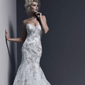 A timeless and sophisticated style, this Chantilly lace fit and flare wedding dress is sweetened with lavish Swarovski crystal beaded lace motifs adorning the bodice and skirt, and edging the hemline. Finished with corset or covered buttons and zipper over inner corset back closure.


<a href="http://www.sotteroandmidgley.com/dress.aspx?style=5SW615LU" target="_blank">Sottero &amp; Midgley</a>