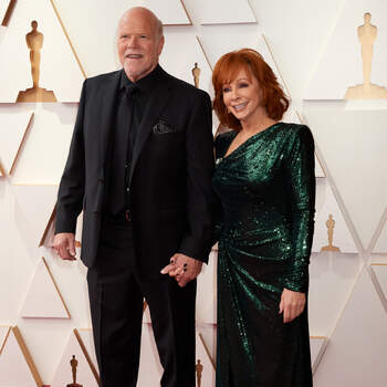 Rex Linn and Reba McEntire arrive on the red carpet of the 94th Oscars® at the Dolby Theatre at the Ovation Hollywood in Los Angeles, CA, on Sunday, March 27, 2022.