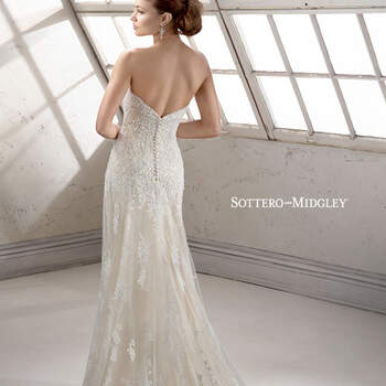 Dramatic lace on tulle with romantic sweetheart neckline and sprinkled with dazzling Swarovski crystals and bold, embroidered lace hemline. Finished with covered button and inner corset zipper closure. Available with detachable cap-sleeves.

<a href="http://www.sotteroandmidgley.com/dress.aspx?style=4SS057" target="_blank">Sottero &amp; Midgley Platinum 2015</a>